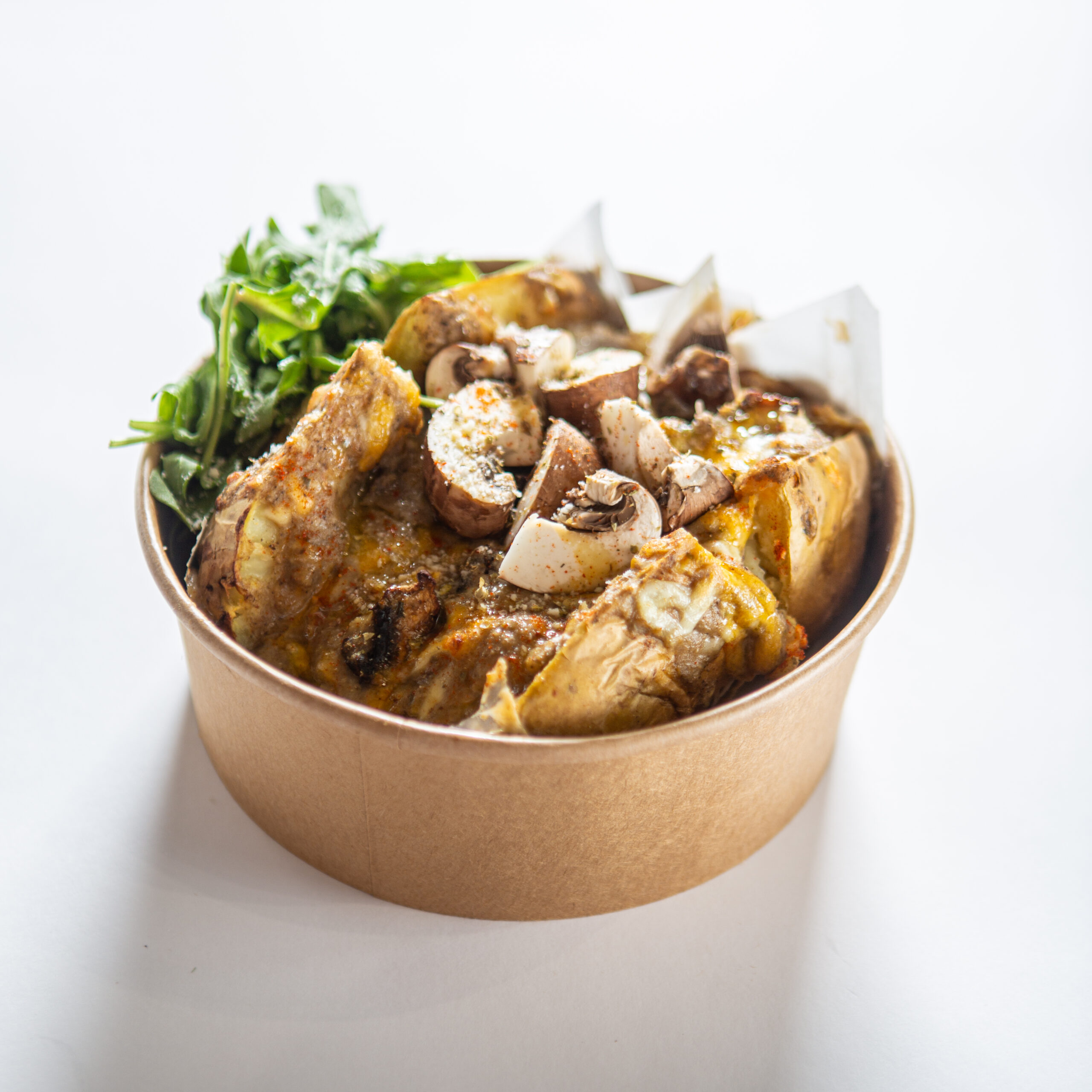 La Trufada — trío de champiñones, trufa, rúcula y parmesano